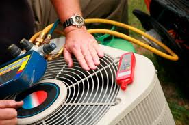 a technician working on an ac unit