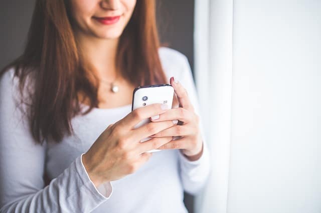 a woman using a smart phone